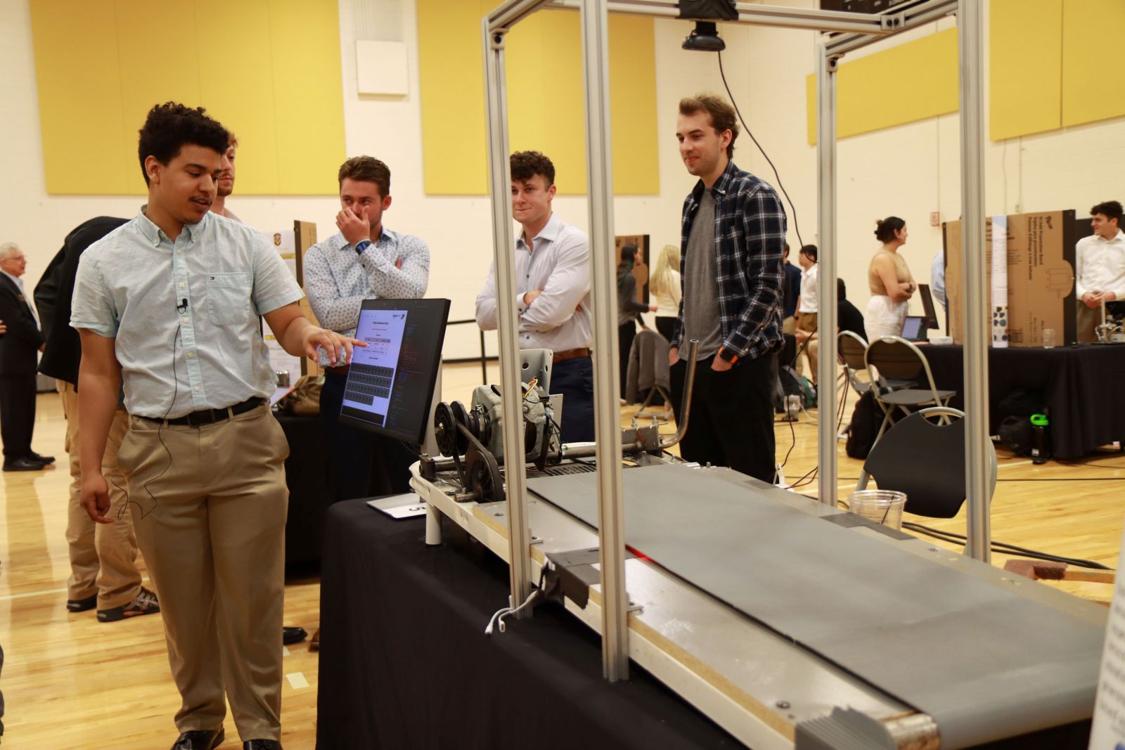 Devon Harmon displays his group's Amazon-sponsored capstone.  (Purdue University photo/Zach Rodimel)