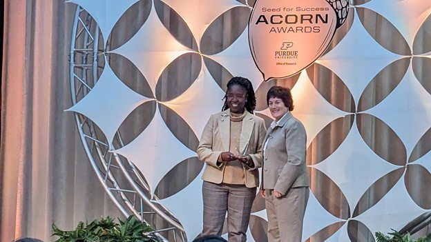 Vetria Byrd, the Department of Computer Graphics Technology's first-ever award winner, with Karen Plaut, executive vice president for research. (Photo provided)