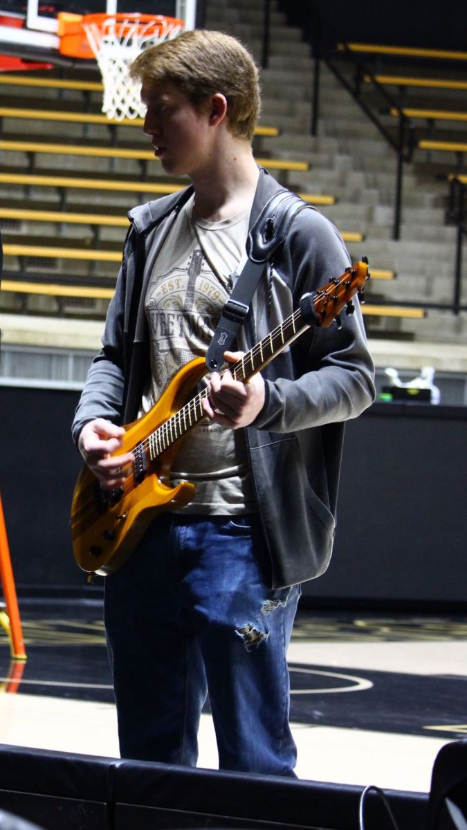 Gryphon Mawhorter with his Mackey guitar creation. (Purdue University photo/Nick Pompella)