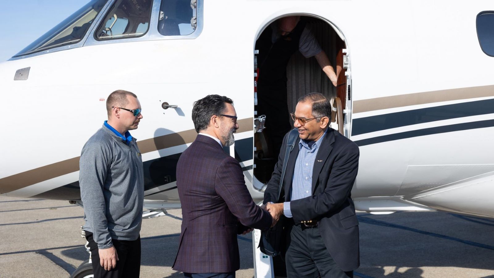 Manoj Patankar (right), head of Purdue Polytechnic's CREATE lab, arrives to meet Flexjet partners at their headquarters in Richmond Heights, Ohio. (Photo provided: Flexjet)