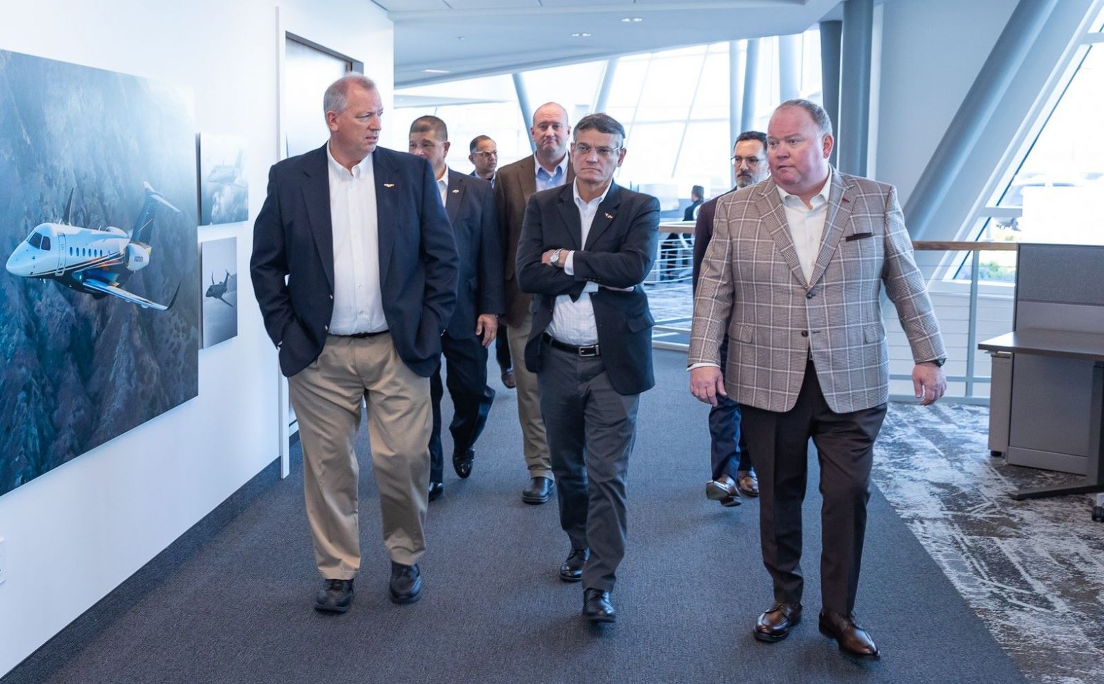 Purdue Polytechnic's Dean Castro (center) tours the Flexware headquarters. (Photo provided: Flexware)