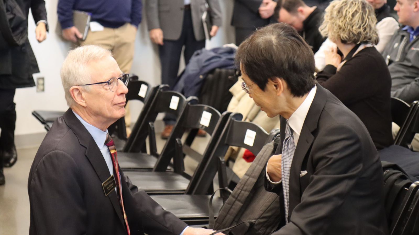 Ken Burbank, head of the School of Engineering Technology, speaks with Jun Yanagi, Japan's midwestern consul-general. (Purdue University photo/Zach Rodimel)