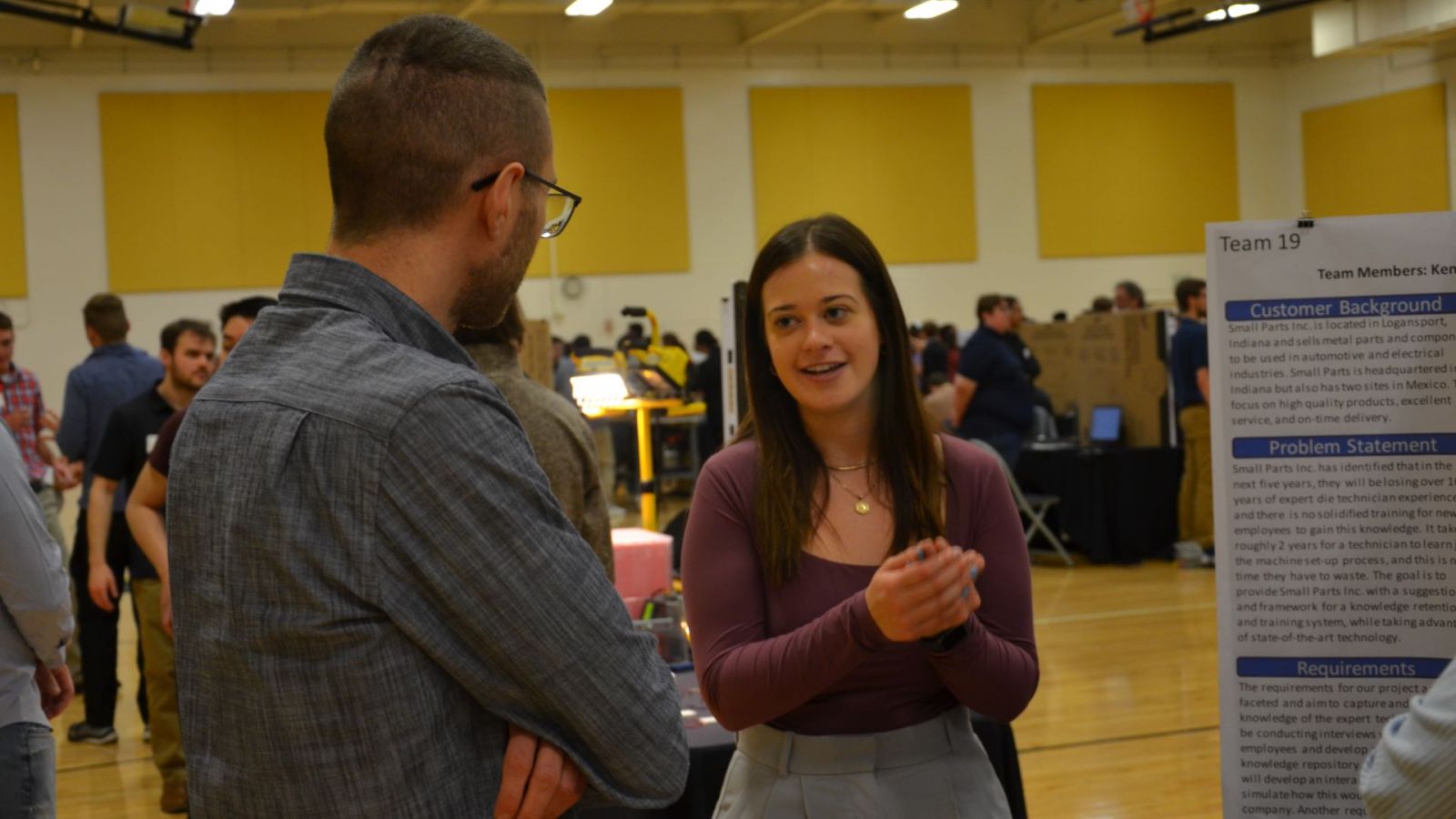 Students in engineering technology discuss their capstones at the 2024 Tech Expo at Purdue University. (Purdue University photo/Zach Rodimel)
