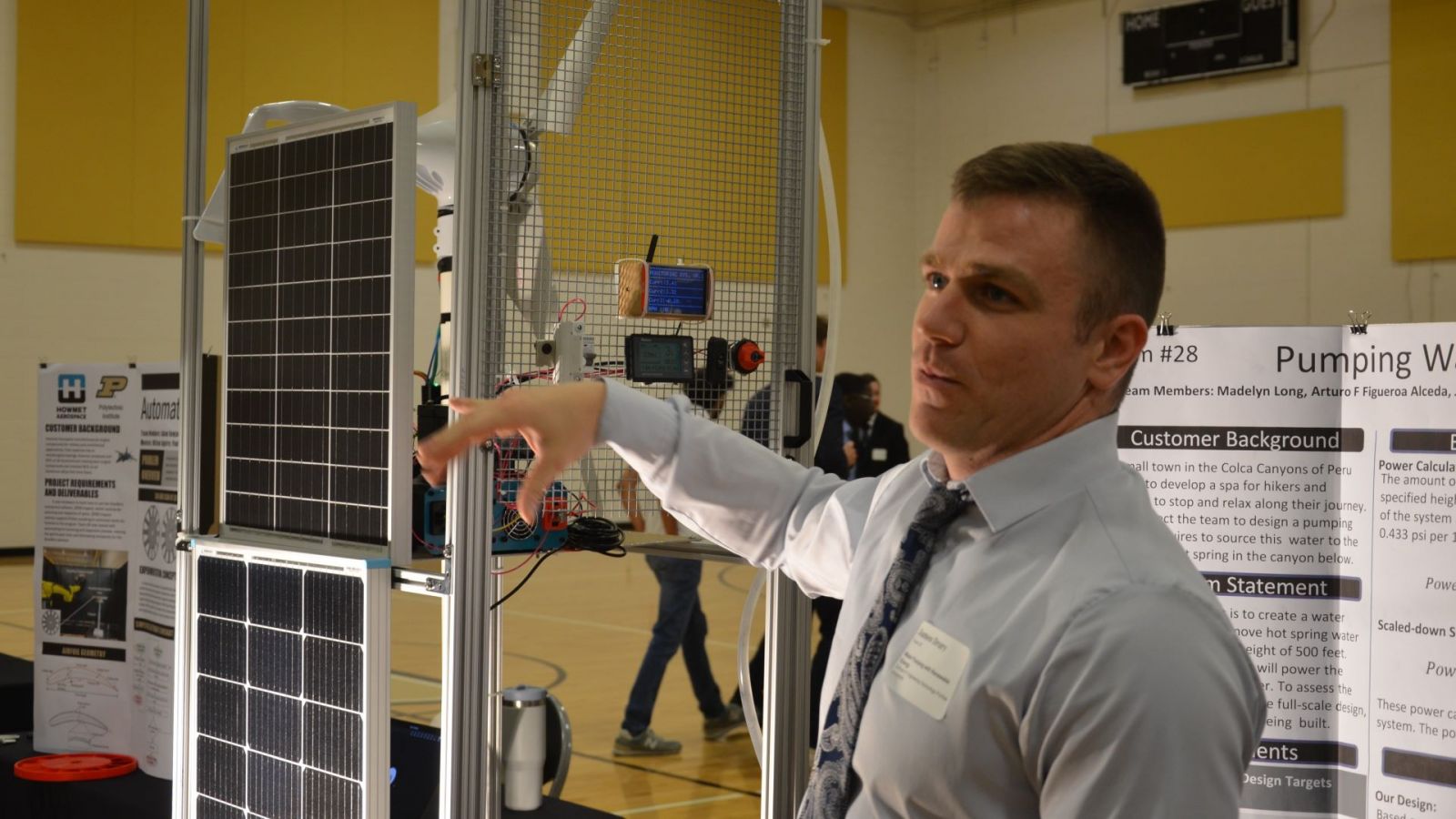 James Drury discusses his team's renewable energy-powered water pump. (Purdue University photo/Zach Rodimel)