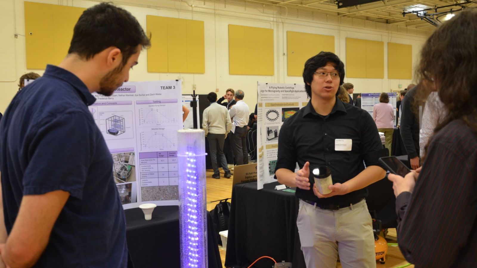 Team 3 discusses their "forever chemical" water purifier. (Purdue University photo/Zach Rodimel)