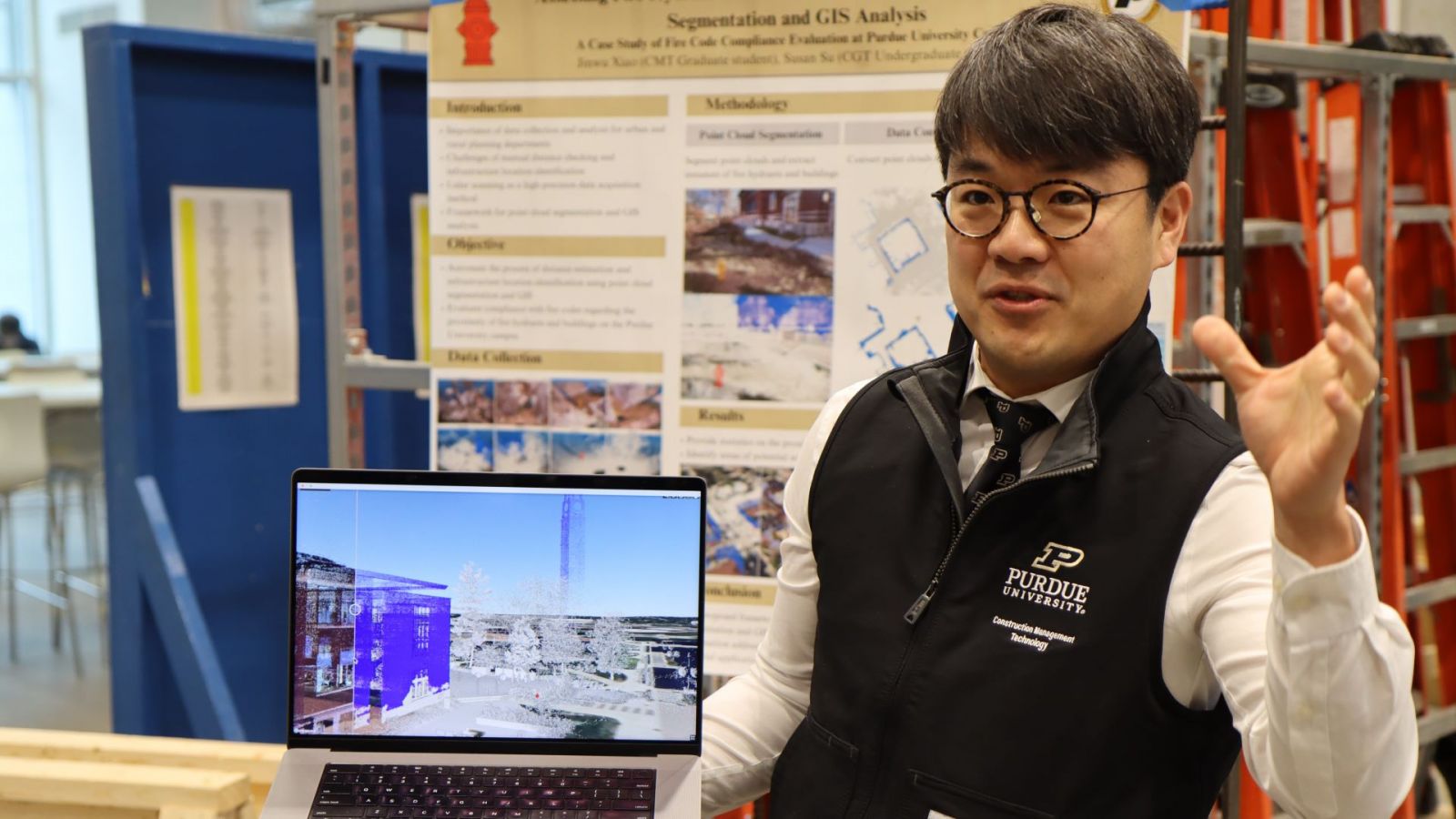 Kyubyung Kang demonstrates a Trimble-enabled full-size model of Purdue University. (Purdue University photo/Zach Rodimel)