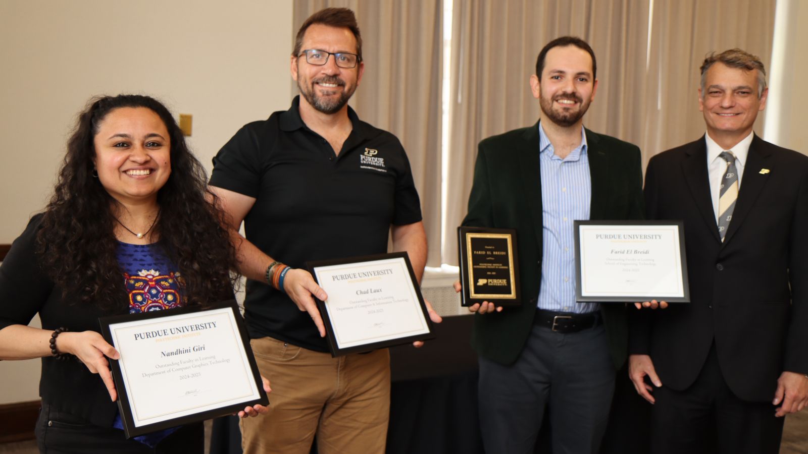 (Left to right) Nandhini Giri, Chad Laux, Farid Breidi and Dean Daniel Castro at the 2025 Faculty and Staff Awards Luncheon. (Purdue University photo/John O'Malley)