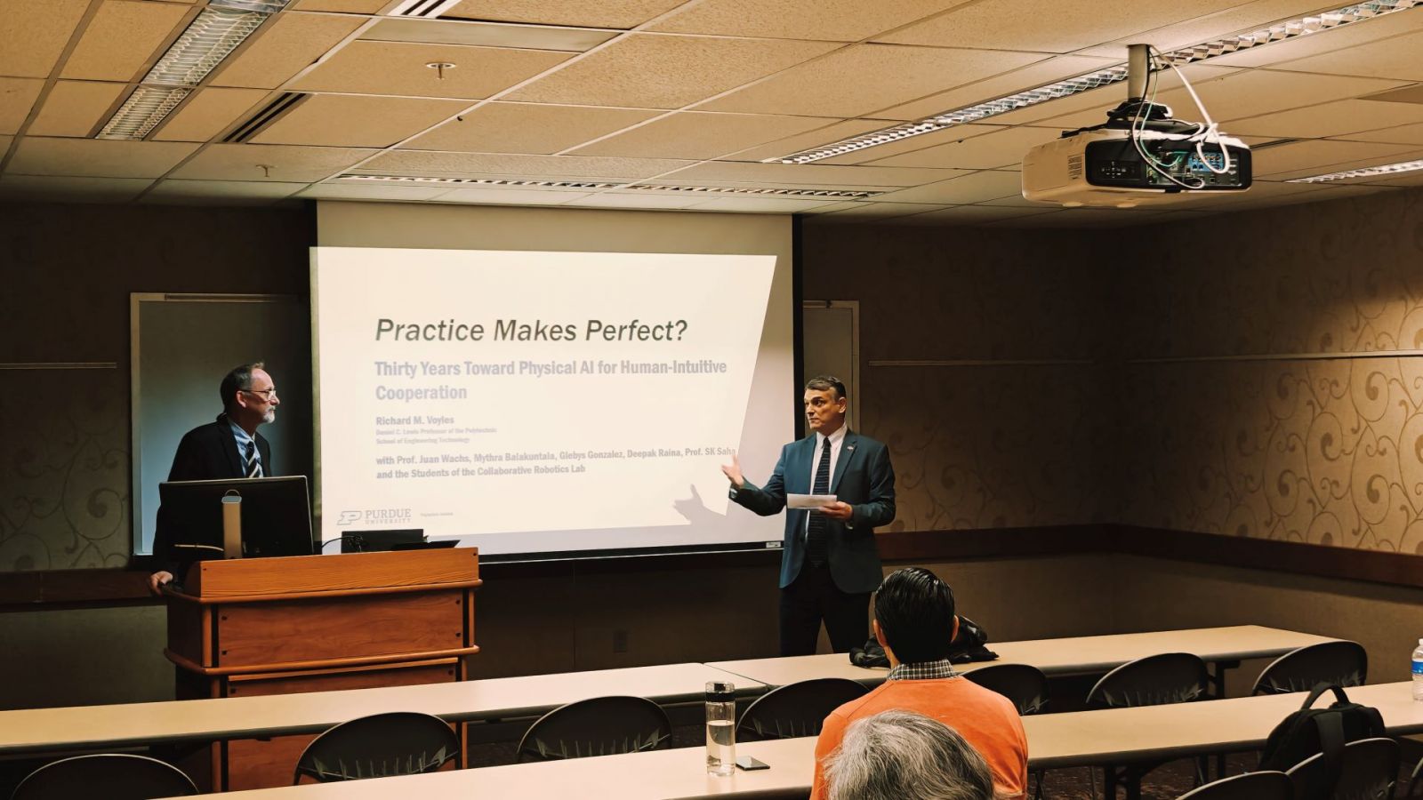 Dean Daniel Castro (right) introduces Richard Voyles during the most recent lecture. (Photo provided/Justin Yang)