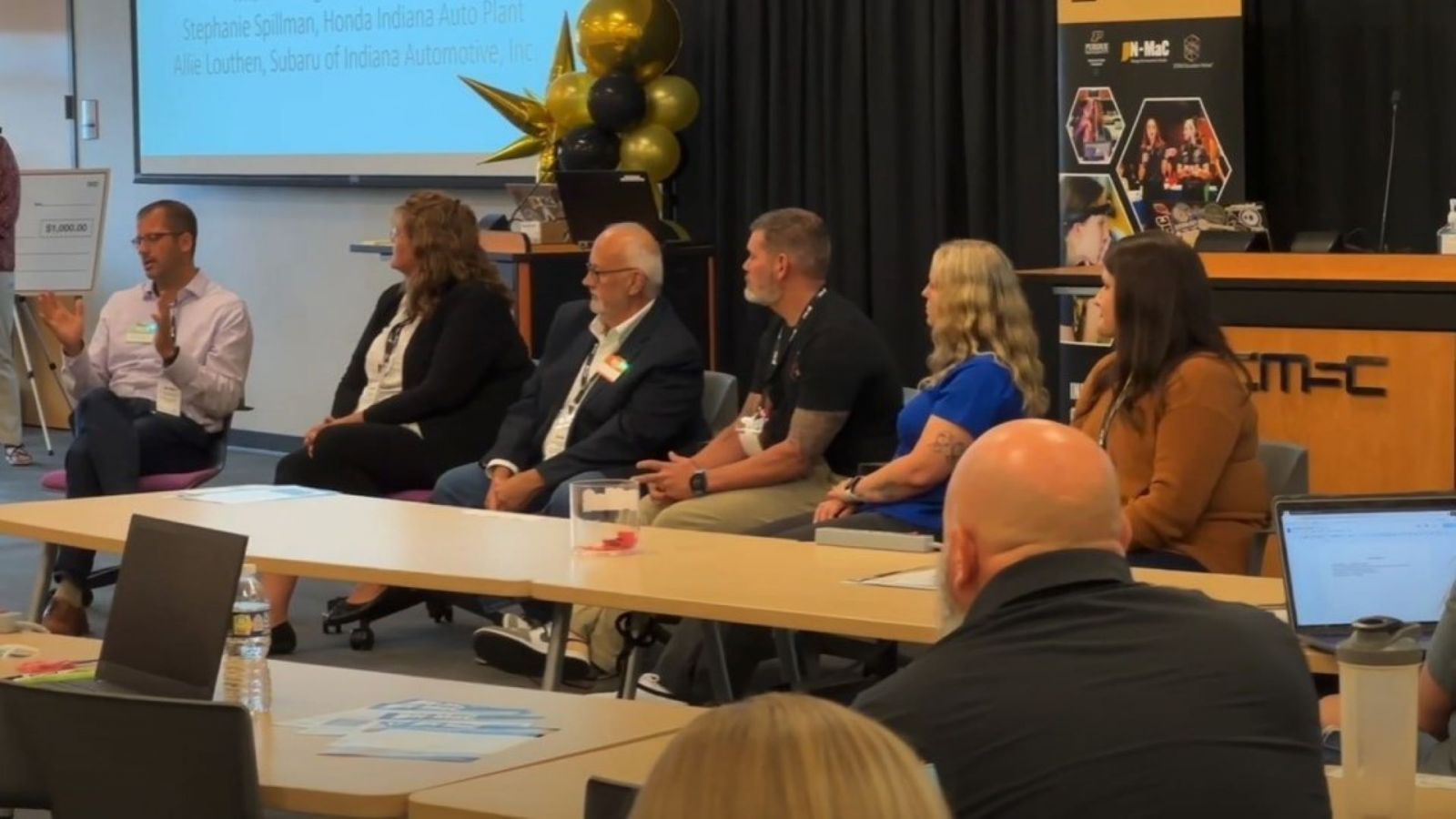 Panelists from corporate and educational partners discuss new topics during the first day of the gathering at IN-MaC. (Purdue University photo/John O'Malley)