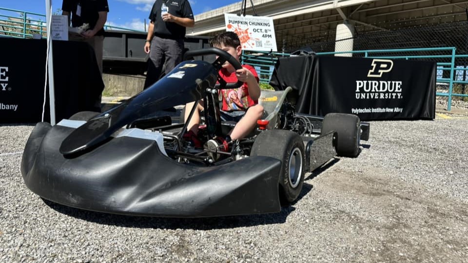 A guest at Touch-a-Truck Day interacts with an EV kart from Purdue Polytechnic in New Albany. (Photo provided)