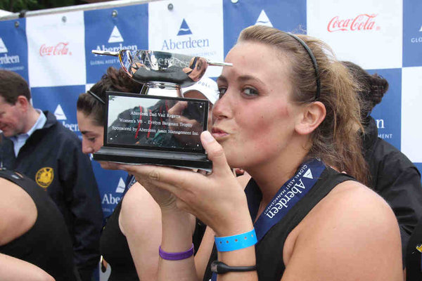 Rachel Young , the No. 4 seat of Purdue’s varsity eight, kisses the trophy presented to the team after it won the final.