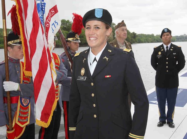 Purdue’s Rachel Young smiles after being sworn in as an Army second lieutenant between heats of the varsity eight.