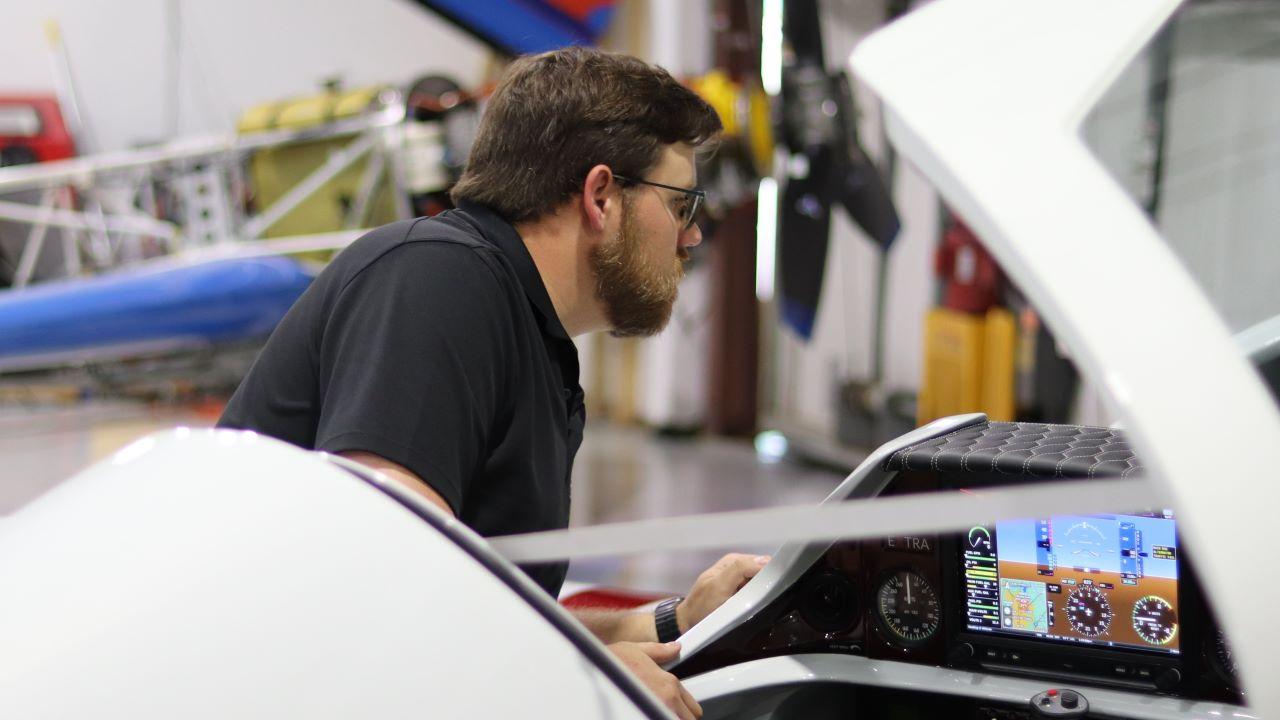 Jordan Ashley performing checks on an Extra performance plane. (Photo provided: Rachel Ashley)