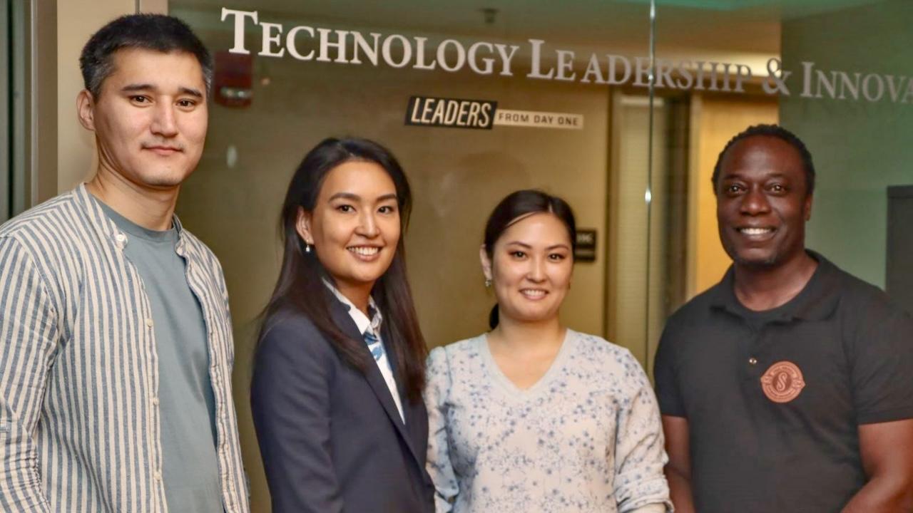 Paul Asunda (right), with three of his primary university partners in Kazakhstan. (Purdue University photo/John O'Malley)