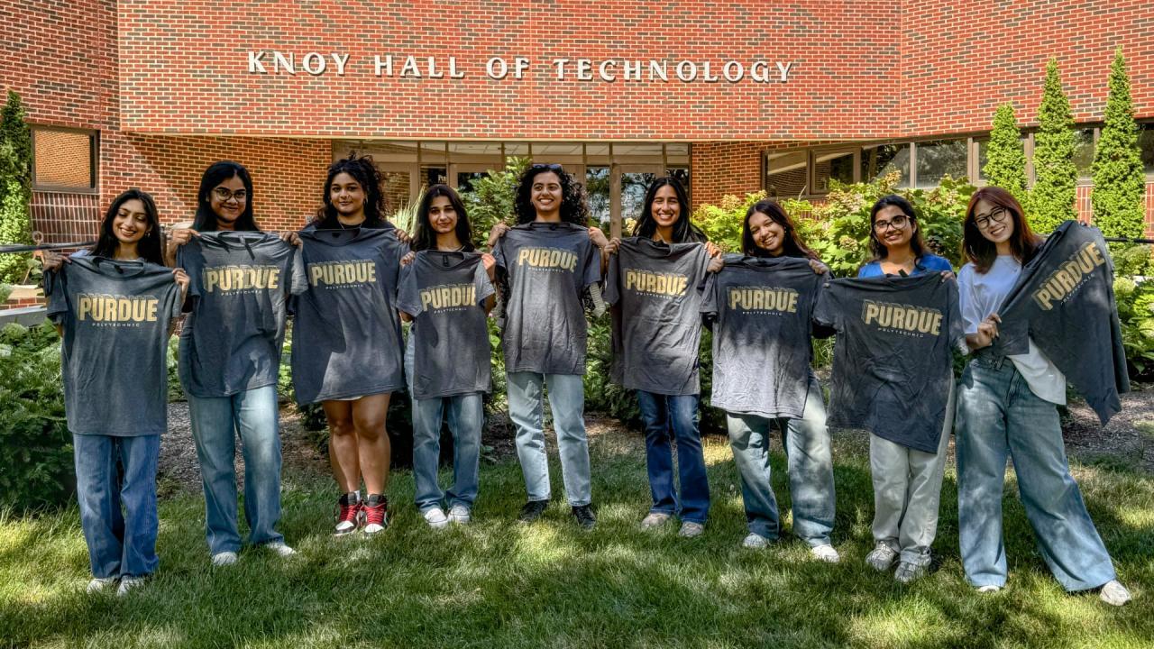 Purdue Polytechnic students pose with new T-shirts during Welcome Week in August. (Purdue University photo/Miah Moore)