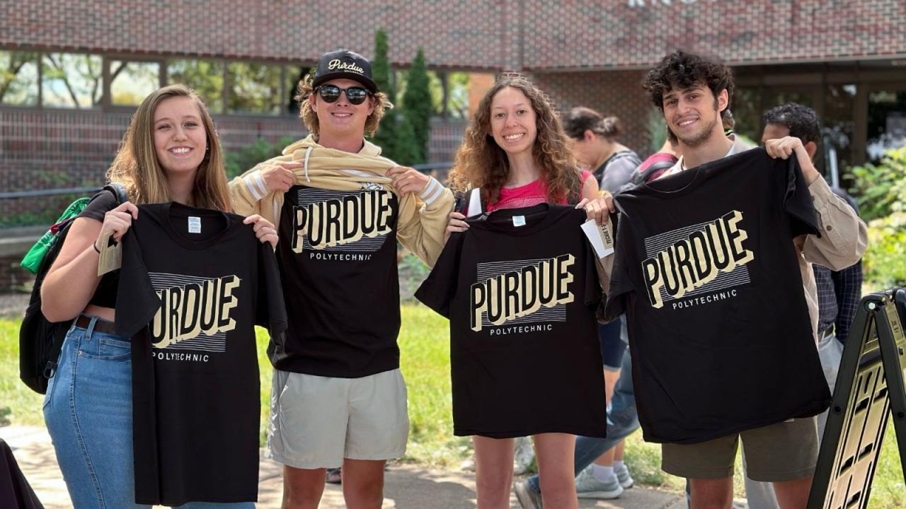 Purdue Polytechnic students pose with new T-shirts during Welcome Week in August. (Purdue University photo/John O’Malley)