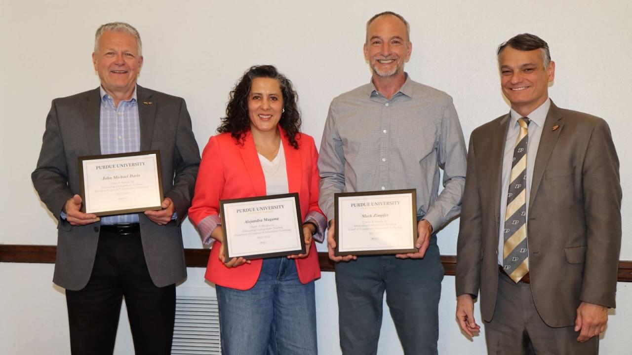 From left to right: Davis, Magana, Zimpfer and Dean Castro at the annual Purdue Polytechnic awards luncheon. (Purdue University photo/John O'Malley)