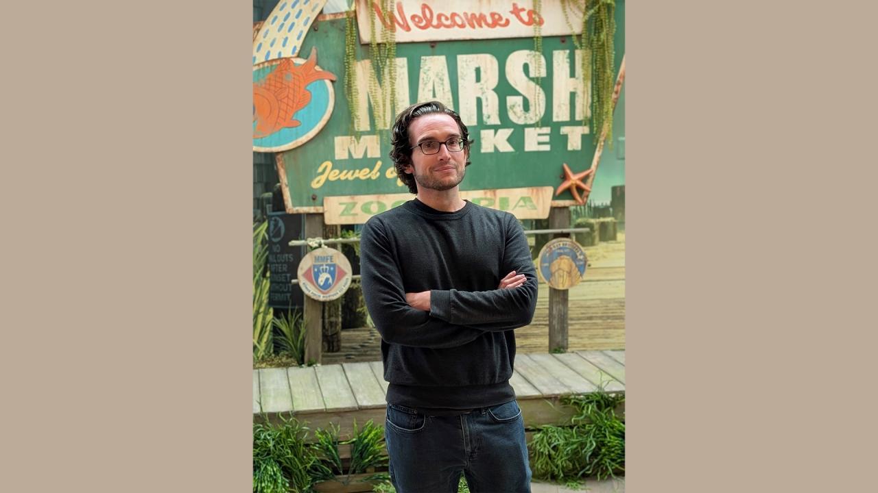 Tyler pictured at the latest D23 convention, in the recreation of Marsh Market, a location that will be featured in Zootopia 2. (Photo provided/Walt Disney Animation Studios)