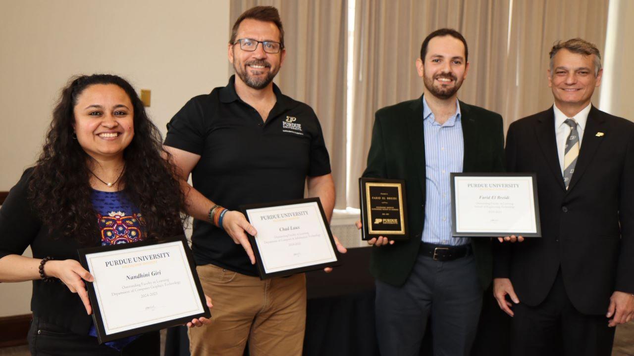 (Left to right) Nandhini Giri, Chad Laux, Farid Breidi and Dean Daniel Castro at the 2025 Faculty and Staff Awards Luncheon. (Purdue University photo/John O'Malley)