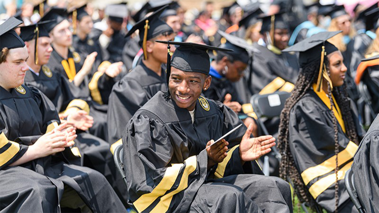 Purdue Polytechnic High School graduates at their 2021 commencement ceremony. This ceremony marked the first time the network graduated students from its PPHS Schweitzer Center at Englewood, North and South Bend campuses. (Purdue University/Rebecca McElhoe)
