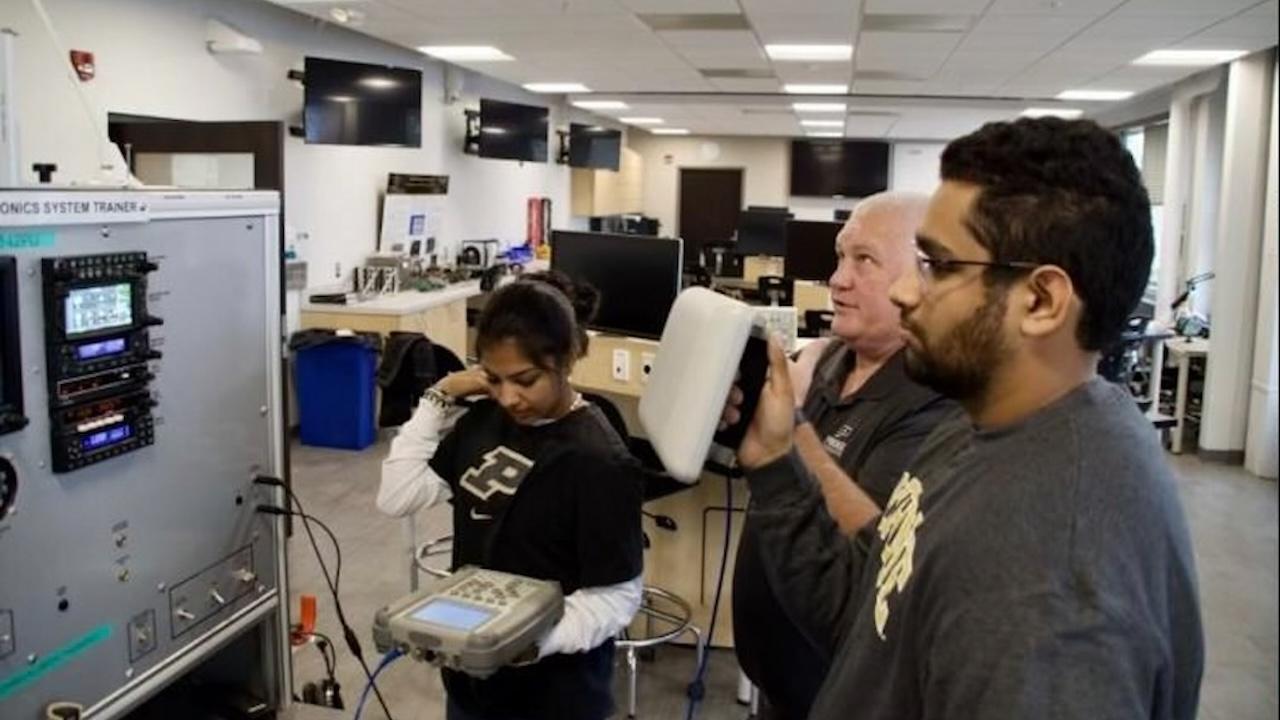 Don Barnes and students in the aeronautical engineering technology program. (Photo provided)