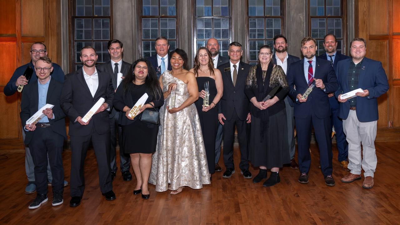 Pictured: All 14 alumni award winners for 2026 with Dean Castro. (Photo credit: Krock Photography)