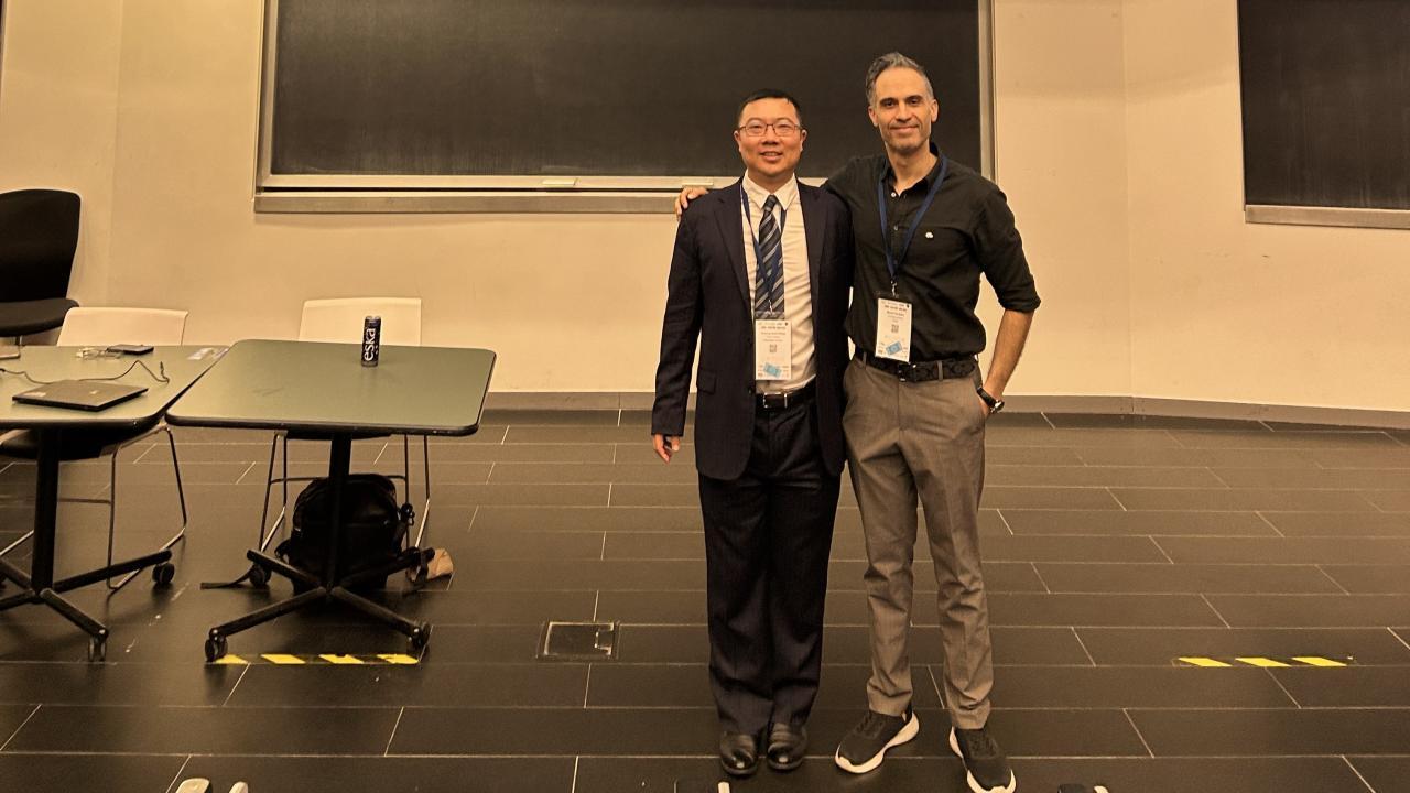 Prof. Jiansong Zhang Poses with a leader of the local organizing committee Prof. Mazdak Nik Bakht (Photo provided)