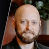 Greg Strimel, associate professor in the Department of Technology Leadership and Innovation, and his published book “Foundations of Engineering & Technology, 8th Edition.” (Courtesy: Purdue Today)