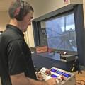 Brock Gillum prepares an engine test with his new portable microcontroller