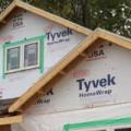A version of Tyvek, the synthetic, waterproof material shown here on a home under construction, can be made into isolation gowns.