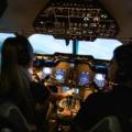 A student pilot and instructor use Purdue Polytechnic's Hawker 900XP flight simulator