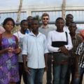 Scott Massey (center, with sunglasses), a founder of Heliponix LLC, poses with residents of Togo