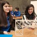 Fernanda Mendoza and Guadalupe Diaz Macias, sophomores at Goshen High School in Goshen, Indiana, display the support structure model they created for the TSA state competition.