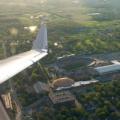 An aerial photo of Purdue's West Lafayette campus, featuring Ross-Ade Stadium and Mackey Arena